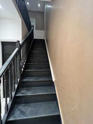 Plastering services on wall of stairway